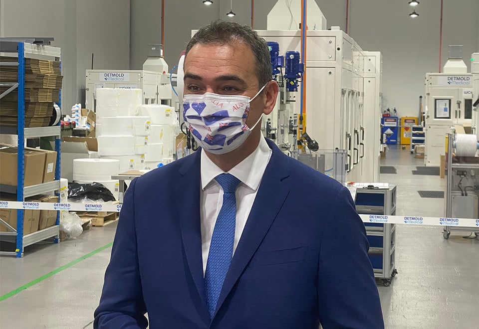 Premier Steven Marshall wears an Australia Day mask